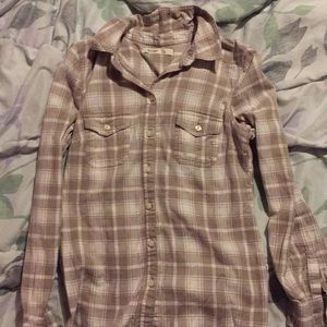 A tan and white button down shirt